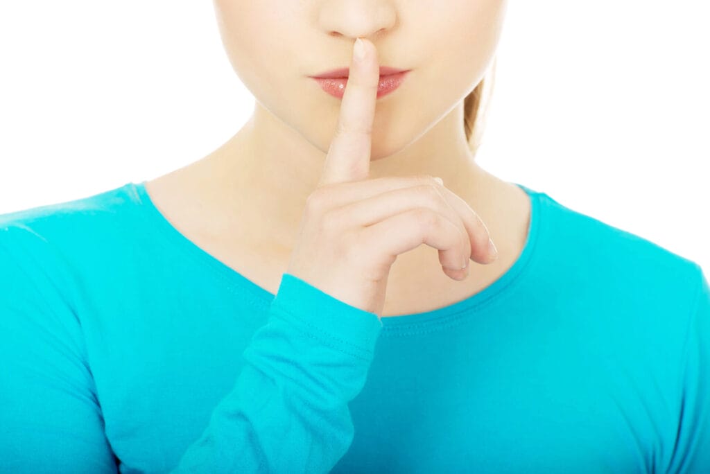 Woman making silence gesture